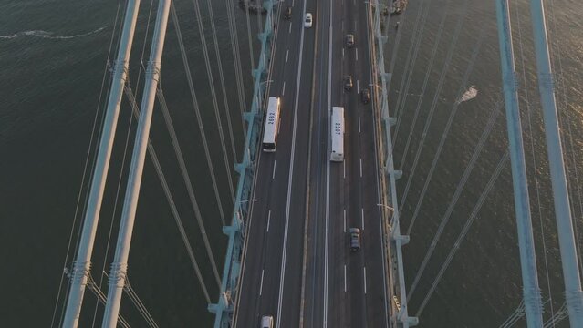 Verrazano narrows bridge with passing cars and trucks