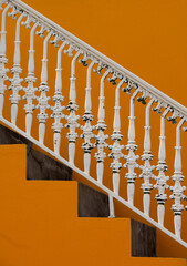antique white ornate iron stair railing ornamental design old style rod iron railing on exterior or...