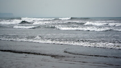Waves breaking on the beach in Canoa, Ecuador