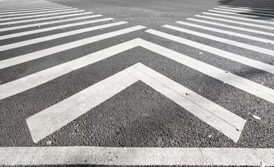 Sidewalk zebra crossing on asphalt road