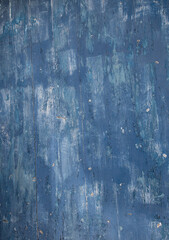 abstract close up design of shades of blue painted exterior wall faded blue paint on cement concrete wall of home weathered and old close up abstract background backdrop painted exterior wall fading 