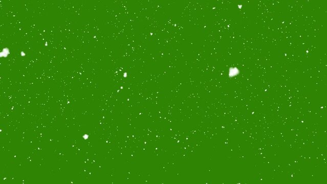 Snow falling on green background