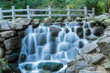 Fototapeta na wymiar Mountain stream waterfall water scenery shooting