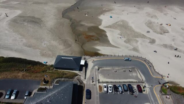 Drone Shot Of A Truck Driving To Park At Nye Beach In Newport, Oregon. This 4K Cinematic Scene, Which Reveals The Beach And The Pacific, Was Filmed Using A DJI Mini 2 Drone.