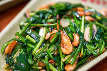 A delicious Chinese dish, fried river prawns with chives