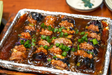 A delicious Chinese dish, teppanyaki eggplant stuffed with meat