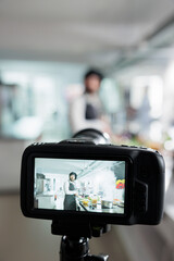 Close up of camera filming gastronomy expert cooking vegetable dish for online culinary school...