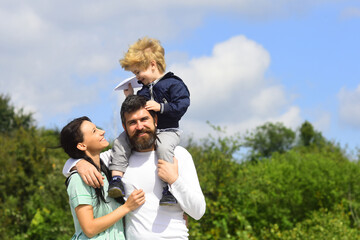 Happy family mother, father and child with toy paper plane. Happy family with children on weekend. Young parents and their child are very happy.
