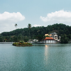 Fototapeta na wymiar Skyline aerial drone view of Kandy lake and temple, stunning place in the heart of Kandy city in Sri Lanka. Famous historical and Buddhism landmark Sri Dalada Maligawa, Sacred Tooth Relic of Temple
