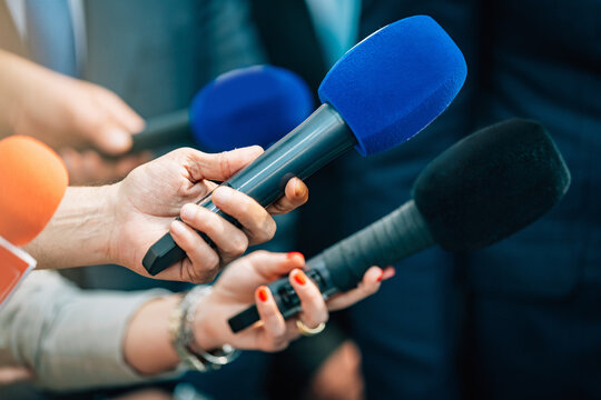 Media interview microphones after a press conference.