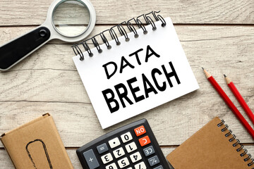 The concept of digital business and technology, text on a notepad on the desktop DATA BREACH.