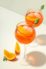Concept of summer alcohol drink, Aperol Spritz on white table