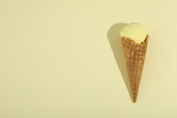 Cone of ice cream on beige background