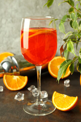 Concept of fresh alcohol drink, Aperol Spritz on dark textured table