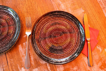 ceramic plates on a wooden table. table setting