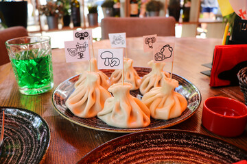 traditional georgian khinkali on a plate. Georgian cuisine. table setting.