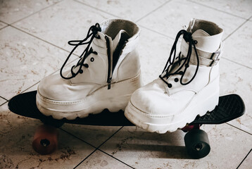 white shoes on a skateboard