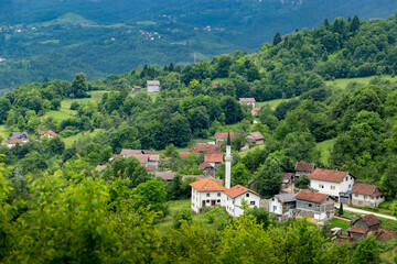 Fototapeta na wymiar Mosque in a small Bosnian village in the mountains.