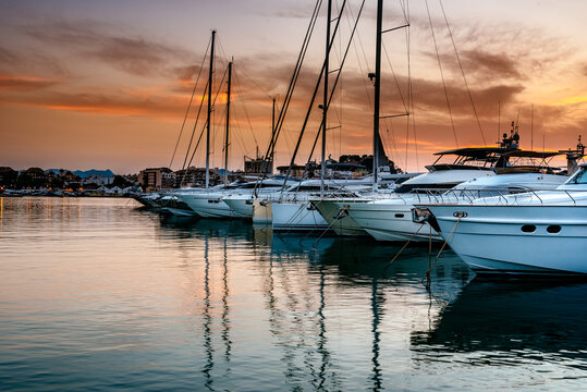 Luxury yachts moored in the Marina of Denia at sunset. Alicante, Spain