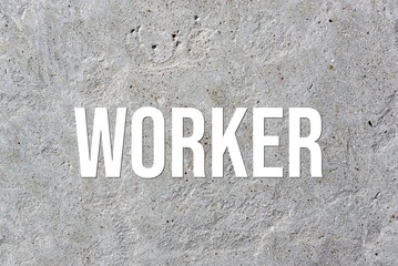 WORKER - word on concrete background. Cement floor, wall.