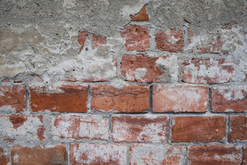 Brickwork under crumbling texture concrete surface