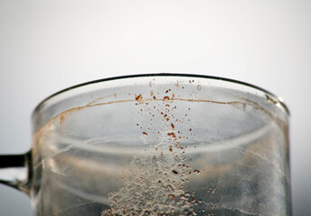 Coffee grounds on drinking glass