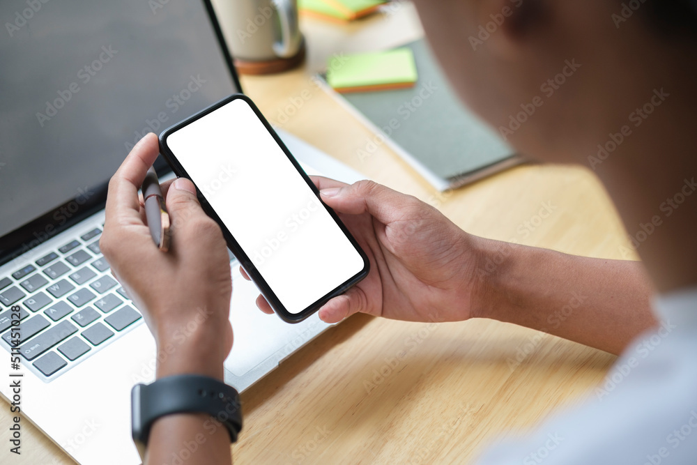 Poster close up view of man holding mock up smart phone with blank screen..