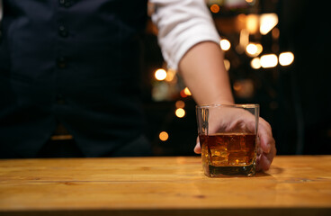 Barman pouring whiskey whiskey glass beautiful night