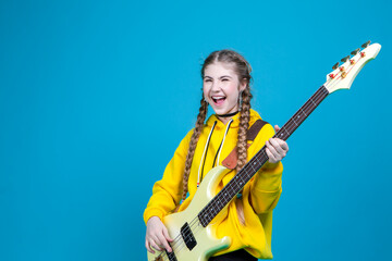 Musical Concepts. One Winsome Caucasian Female Guitar Player With White Bass Guitar Holding...