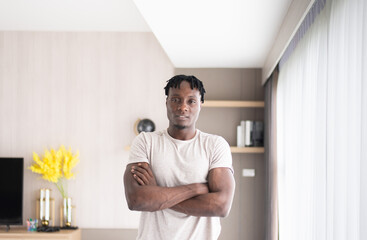 Portrait of african men cross arms and standing looking to camera at home
