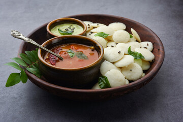 Mini idli is the smaller version of soft and spongy round shaped steamed regular rice idli, also known as button and cocktail idly