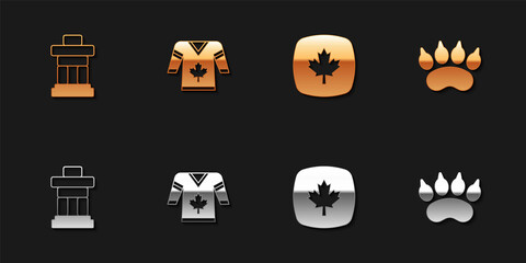 Set Inukshuk, Hockey jersey, Canadian maple leaf and Bear paw footprint icon. Vector