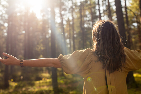 Nature, Spirituality And Supernatural Concept - Young Woman Or Witch Performing Magic Ritual In Forest