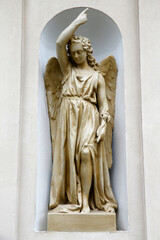 Angel statue in a niche, Paris, France. 22.03.2018