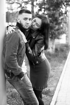 Couple in love on romantic dating, sensual relationship and desire of lovers, young man and woman having fun together outdoors, happy family life and candid lifestyle, vertical black white image