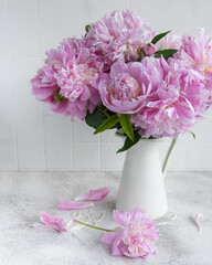 Beautiful bouquet of flowers: white and pink  peonies.