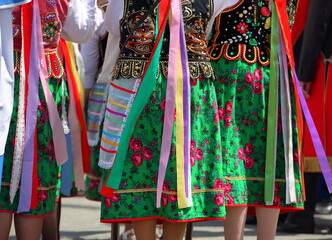 Naklejka premium Women in tradtional colorful folk costumes from Krakow region in Poland