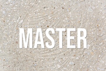 MASTER - word on concrete background. Cement floor, wall.