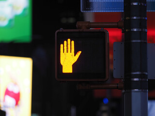 Image of a pedestrian traffic light near Times Square.