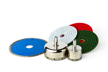 Diamond flexible abrasive disc for grinding machine and crowns for tiles on white background.