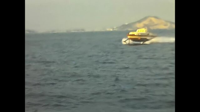 motorboat in motion at the sea in procida 60s