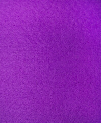 Purple felt fabric close-up. Abstract background. The texture of the fibers. Velvet surface.