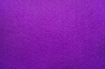 Purple felt fabric close-up. Abstract background. The texture of the fibers. Velvet surface.