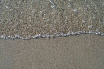 water waves bubbles on the sand surface
