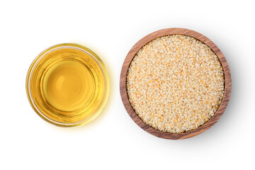 Sesame seed oil with white sesame seeds in bowl isolated on white background. Top view. Flat lay. 