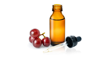 Grapes seed oil in dropper bottle isolated on white background. 