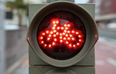 Red cyclist traffic light on bicycle lane
