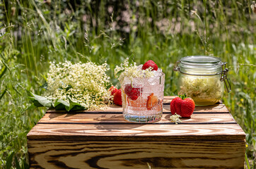 Refreshing drink in summer day. Elderflower strawberry lemonade.