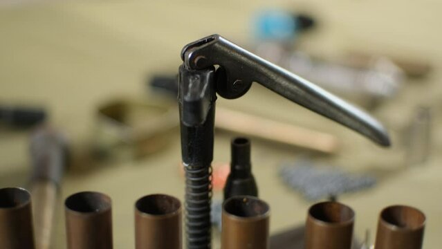 shotgun cartridges reloading. capsules, shells, powder, cartridges, scales on the table