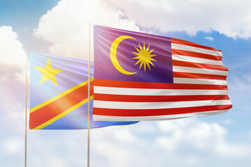 Sunny blue sky and flags of malaysia and dr congo
